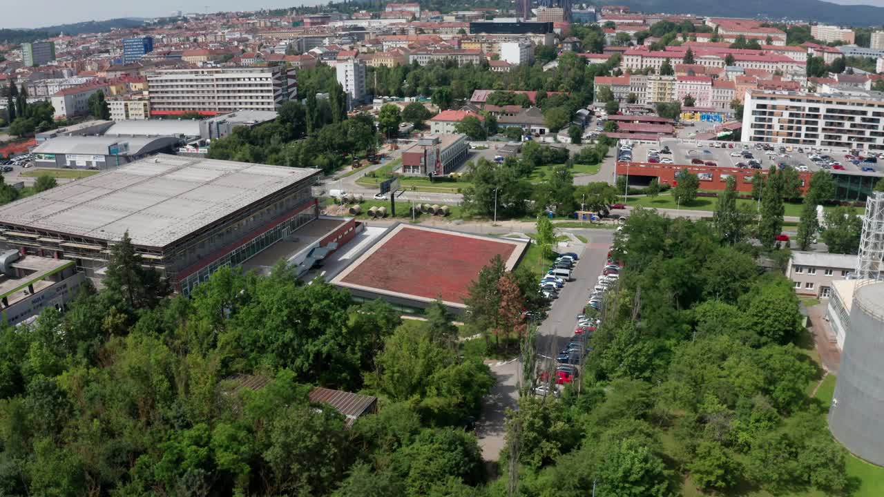 side drone shot of public indoor swimming pool in brno city