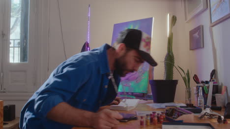 painter walking in art studio in the morning