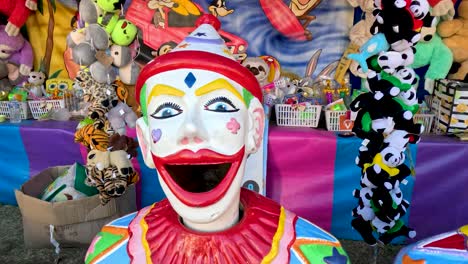 clown statue with colorful toy background