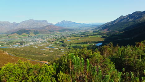 sweeping top view over lush wine growing valley of franschhoek, south africa