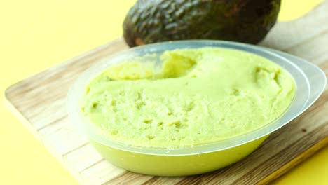 avocado spread on a chopping board ,