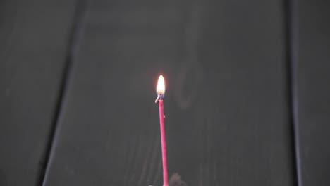 a time lapse of a birthday candle burning down