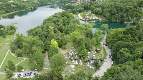 Panorama-aerial-tilt-up,-medieval-Watermills-of-Jajce-in-Bosnia-and-Herzegovina