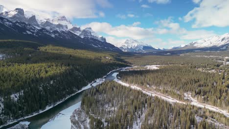 Aerial-view-of-Bow-river-and-mountains,-Canmore,-Alberta,-Canada