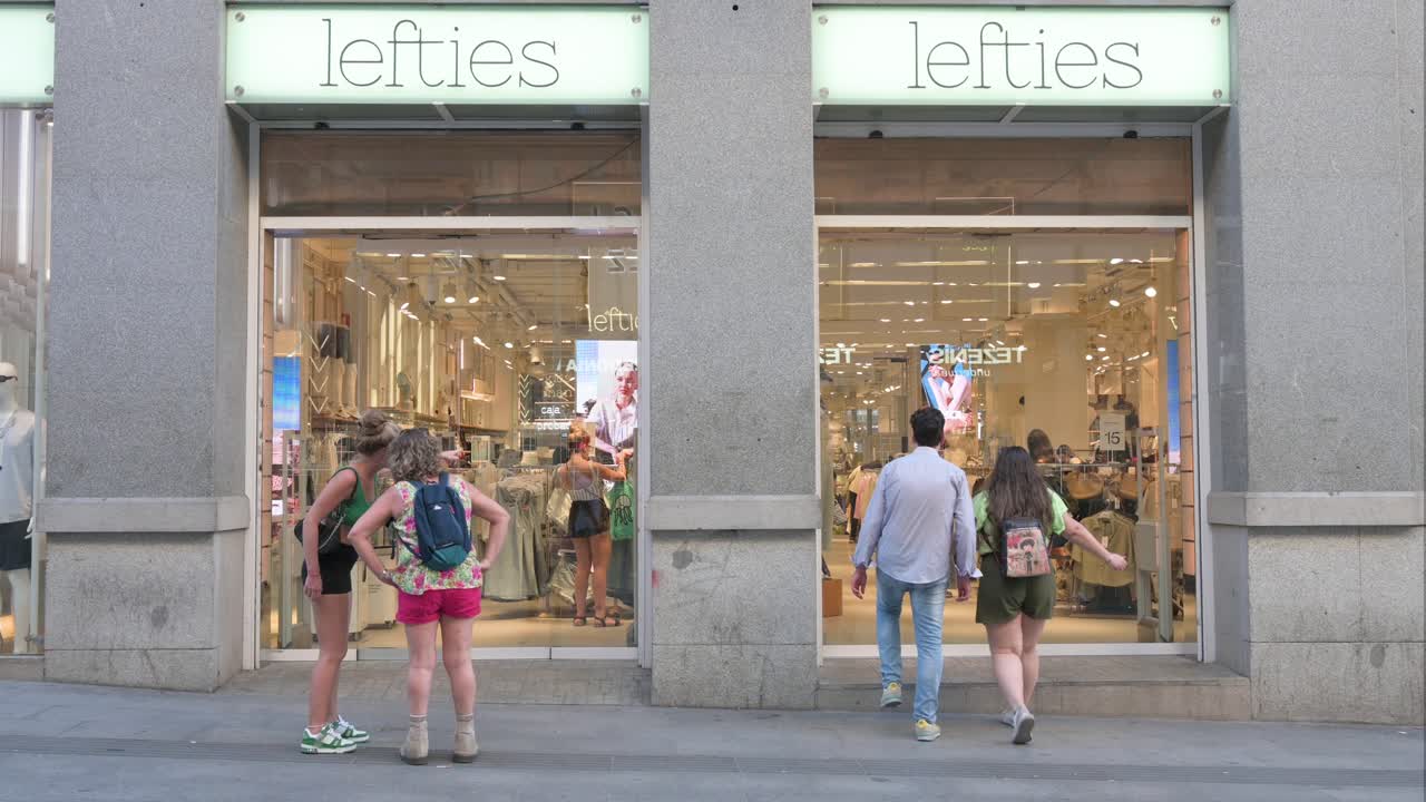 Shoppers and passersby are seen at the Lefties store, a Spanish fashion brand under Inditex, situated near Plaza del Sol and the bustling retail area of Gran Vía in Spain.