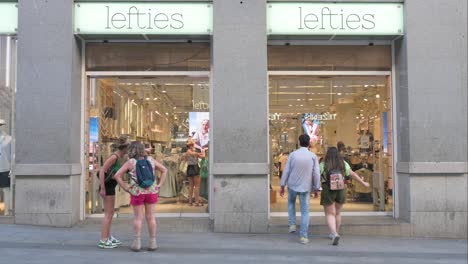 shoppers and passersby are seen at the lefties store, a spanish fashion brand under inditex, situated near plaza del sol and the bustling retail area of gran vía in spain.