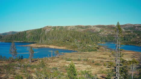 breathtaking views of pristine lakes can be seen by hiking the seterdjupna to malitjønna route in indre fosen, trøndelag, norway - handheld shot