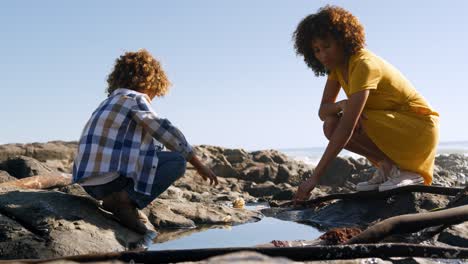 Mother-and-son-having-fun-together-at-beach-