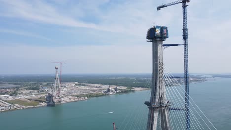 Construction-site-of-Gordie-Howe-international-bridge,-aerial-drone-view