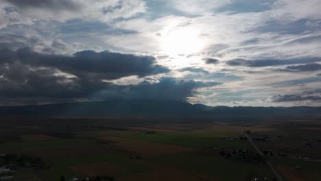 aerial drone shot panning to the left of dramatic sunlight beam