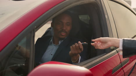 man receiving car keys