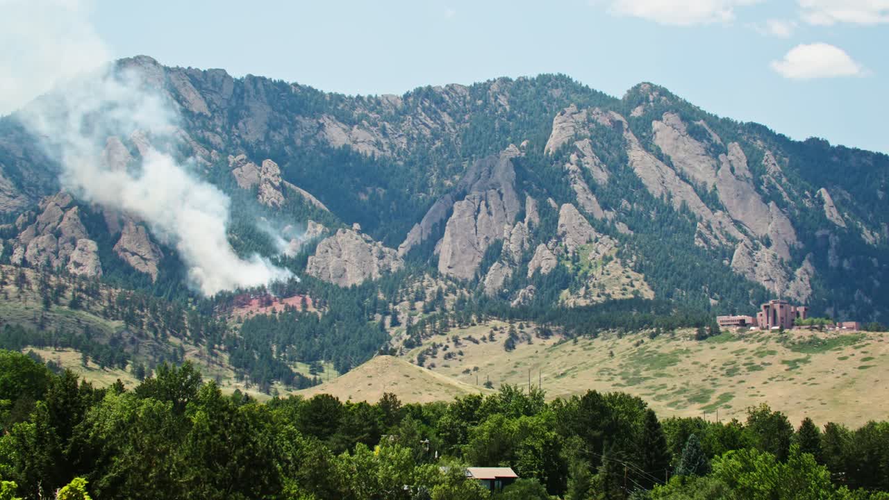 Wildfire Smoke Over Mountain Landscape