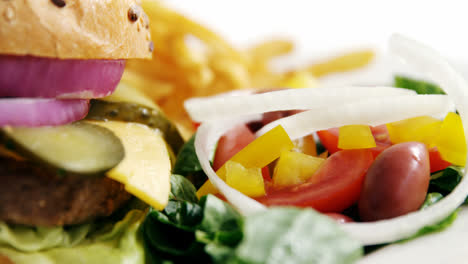 Snacks-and-salad-against-white-background