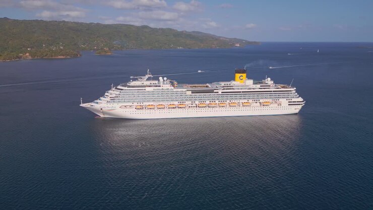 Aerial view of Costa Pacifica luxury cruise liner near Caribbean coastline