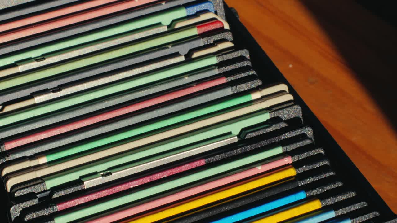 Using diskette for old computer. Music recorder, playing retro computer games. Vintage device for office, obsolete technology. . High quality 4k footage