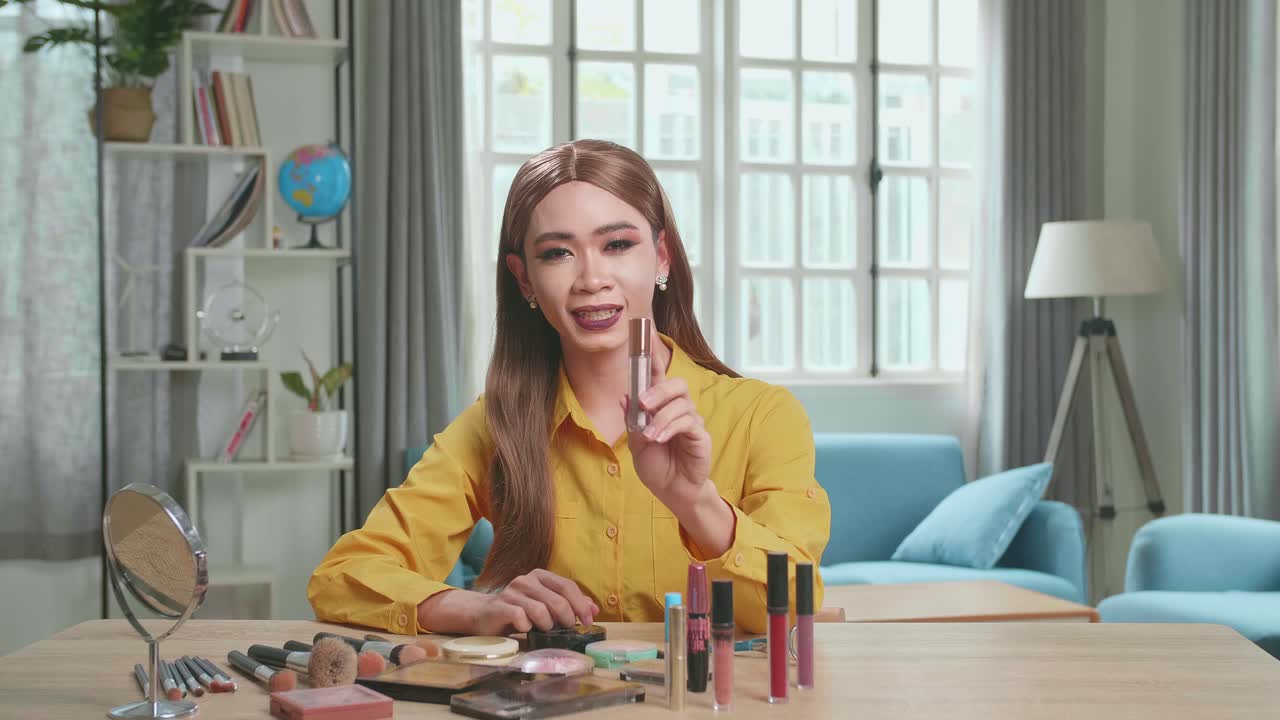Influencer Young Transgender Woman Blogger Talks About Makeup. Blogger Talks Facial Beauty Treatments. Vlogger Broadcasts How To Use Of Cosmetic In Home Studio