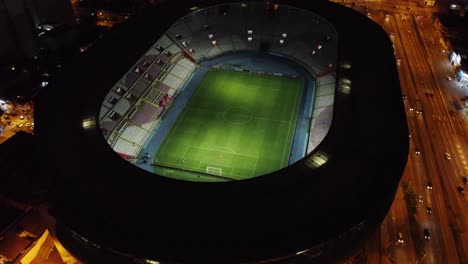 drone video of peru's national stadium during night time