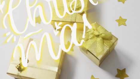 Animation-of-merry-christmas-over-presents-on-white-surface