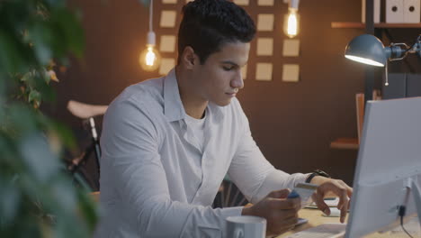 man paying bill online