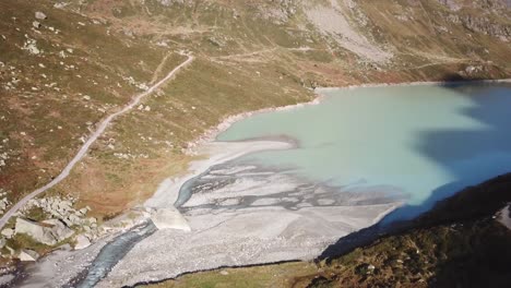 Vertical-Drone-flight-Alps-blue-Lake-in-Austria-Vorarlberg