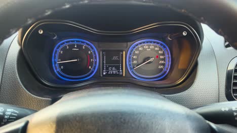 view of instrument cluster of a accelerating indian car