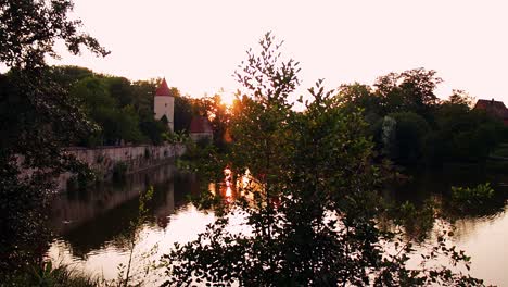 a lake in the park at sunset