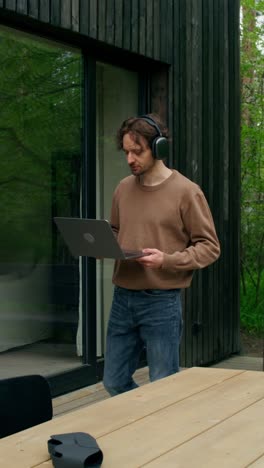 man working from home on a laptop