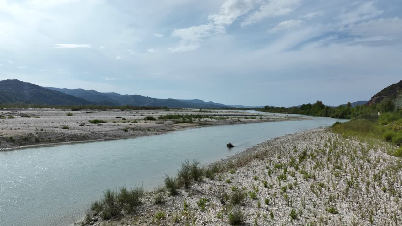 Scenic riverbank in an Albanian national park with stunning natural views and peaceful landscape.