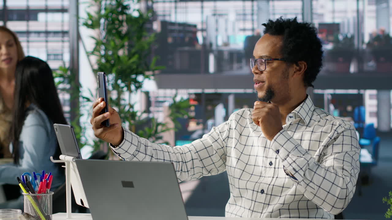 Man taking selfie in office