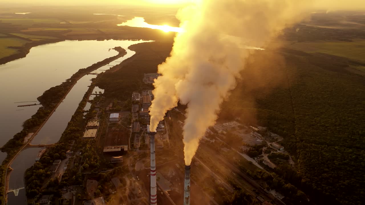 Smoke from industrial chimney. Air pollution by smoke coming out of two factory chimneys