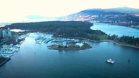 beautiful drone shot of a lakeside city and mountain range