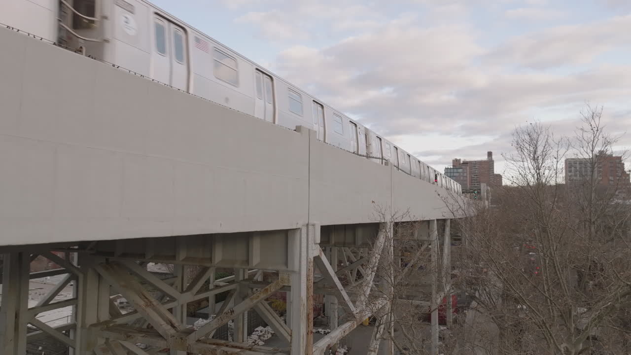 Aerial view of the subway on an elevated railway track in Brooklyn. Shot on an overcast day in Gowanus.