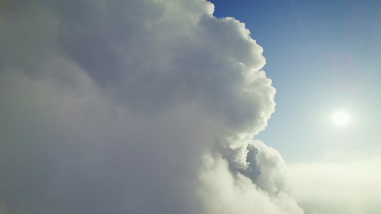 Fluffy Clouds and Sun