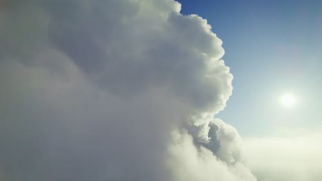 fluffy clouds and sun