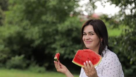 Happy woman in leisure holding watermelon in hand 4k 2025 08 04 08 37 55 utc.mov | bites, cool, crunchy, delicious