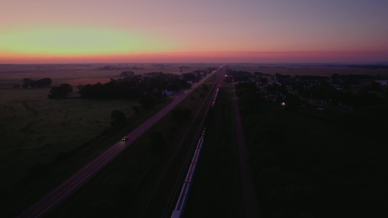 Aerial view of road and railroad tracks with a stunning sunset skyline in Omaha, Nebraska, United States
