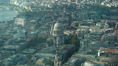st paul's cathedral of london in middle of smaller buildings. view from above