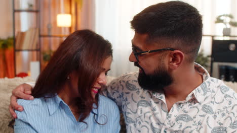 indian family couple man woman touching face and looking at each other with love and tenderness