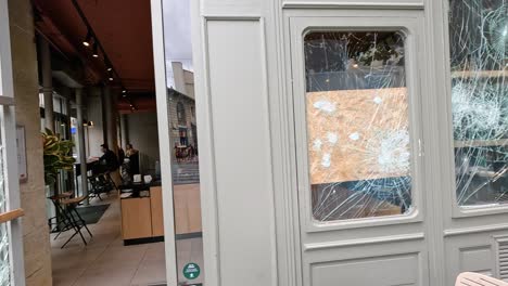 cracked window at a bordeaux cafe location