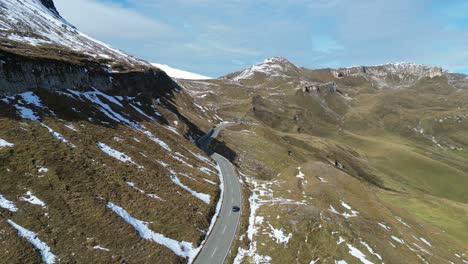 Car-Drive-Grossglockner-High-Alpine-Road-at-Sunny-Day-in-Austria-Alps---Aerial-4k-Follow