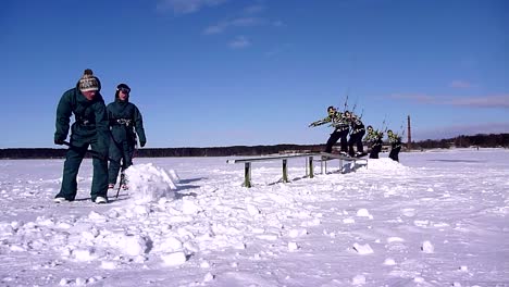 winter snowkiting on the rail with freeze frame effect , kiter frozen in time shot in the suny winter day.