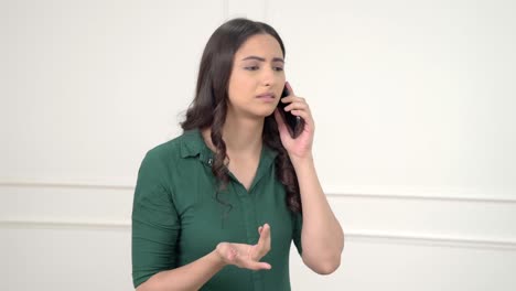 Frustrated-Indian-woman-talking-on-call