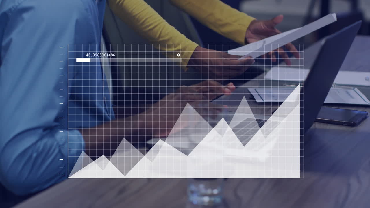 Financial data chart animation over people working with documents in office