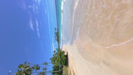 fpv shot of playa los cocos in maria trinidad sanchez, dominican republic. beautiful beach known for its serene environment and clear waters. this beach is approximately 1.5 kilometers long.