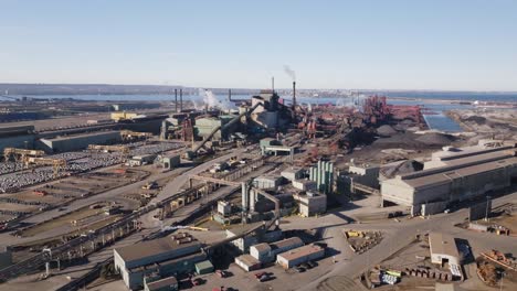 Hamilton's-industrial-sector-with-steel-factories-and-smokestacks,-aerial-view