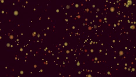 animación de manchas amarillas y rojas de luz saltando en movimiento hipnótico sobre fondo negro
