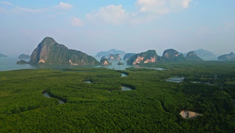 backward-drone-shot-of-Samet-Nangshe,-One-of-most-famous-place-in-south-of-Thailand-with-mangrove-forest-and-limestone-mountains-in-Andaman-sea