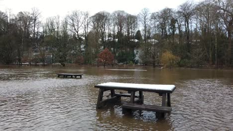 river bollin in wilmslow, cheshire, england, uk after heavy rainfall and bursting its banks