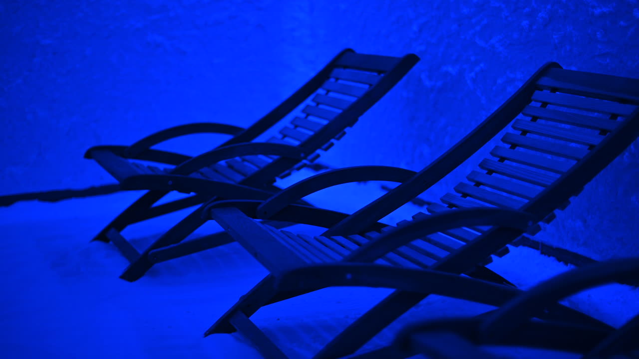 Resting chairs in a salt room with blue light
