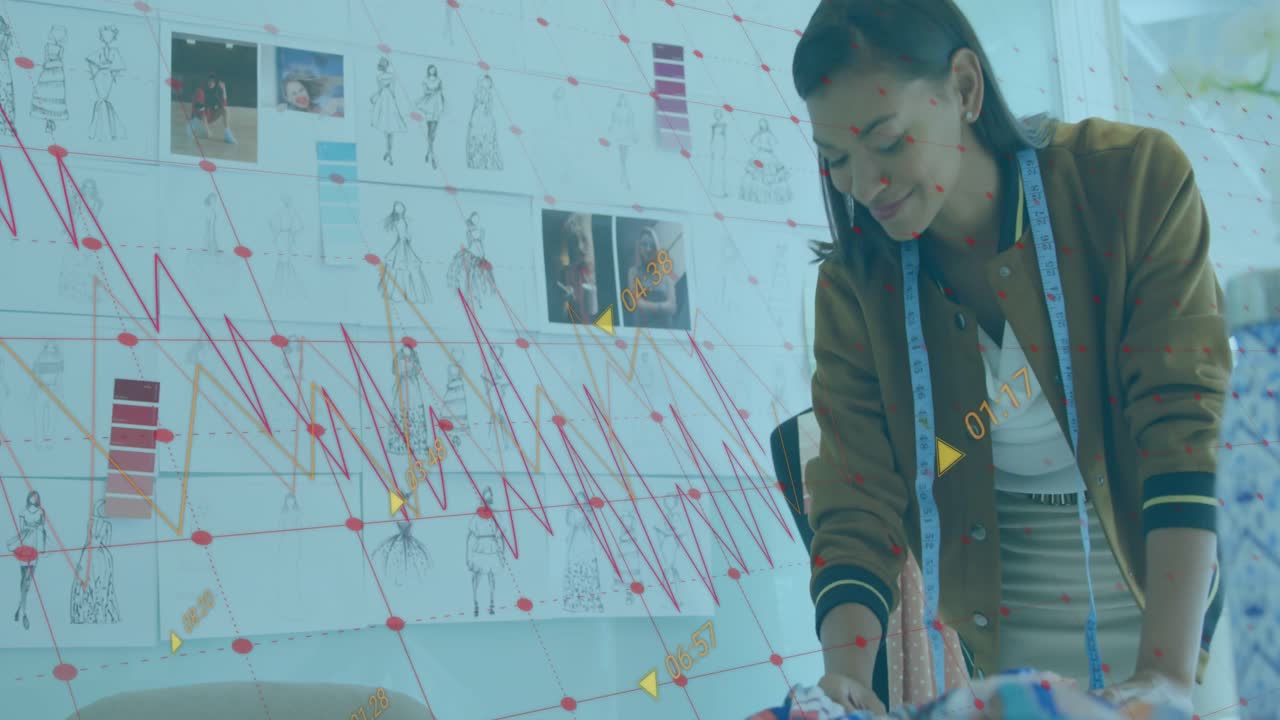 Animation of data processing against female fashion designer working at a studio